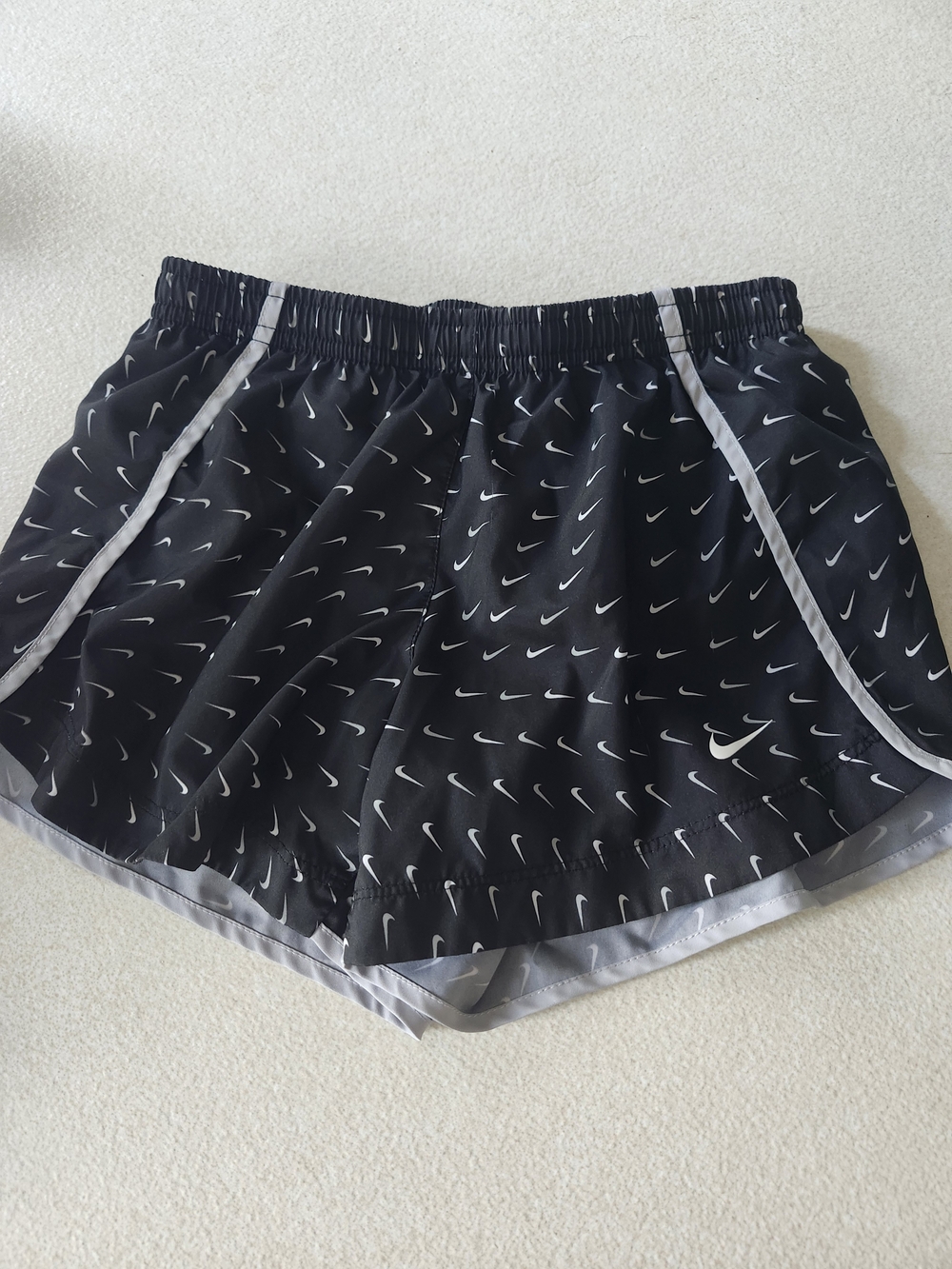 Nike Black Athletic Shorts with White Swoosh Print